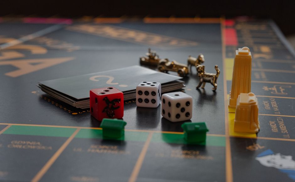 Board game tokens and pieces scattered on a table