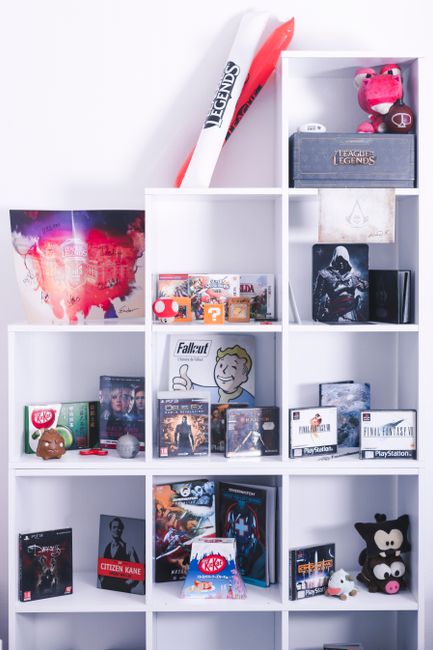 A shelf of many different board games