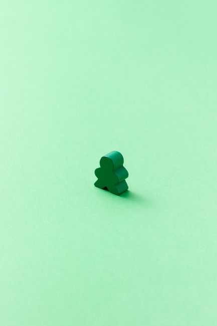 Wiping down board game pieces with a soft cloth