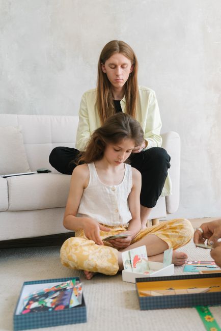 A family of mixed ages playing a board game together
