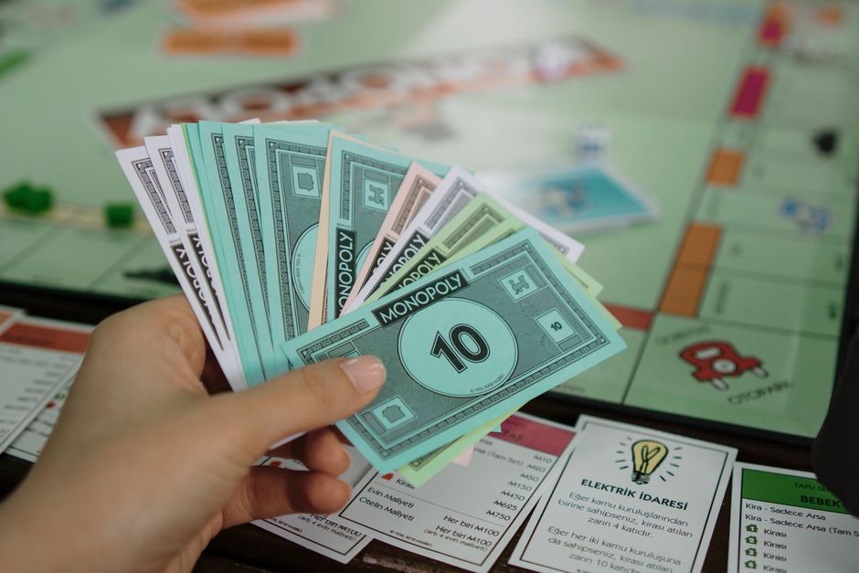 A Monopoly board game set up with money and properties