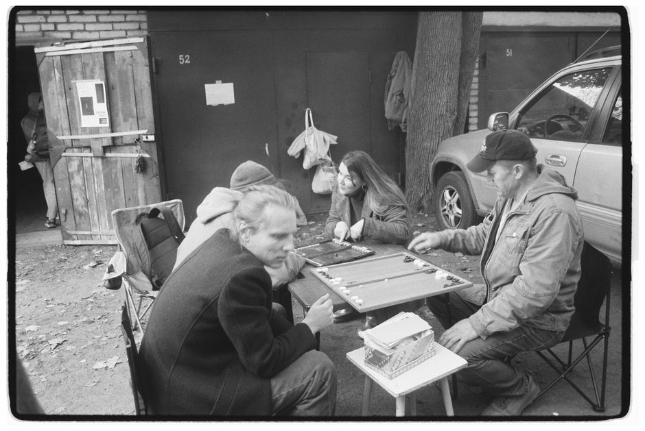 A group of new acquaintances playing a board game together