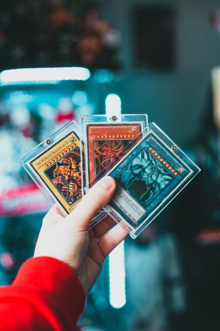 A deck of sleeved game cards being shuffled